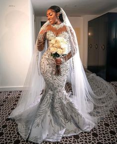 a woman in a wedding dress is posing for the camera