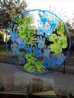 a blue and green glass sculpture on top of a table