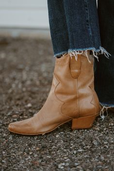 The prettiest pair of boots you'll ever own! And there's no zipper to worry about, because this boot works for everyone! Updated pull-on Western bootie with subtle stitch detailing. Please note that the leather used on this boot will age and distress with wear. Details: Leather upper. Manmade outsole. 7 in / 17.78 cm shaft height. 10 in / 25.4 cm boot opening. 2 in / 5.1 cm heel. Textile lining. Padded insole. Pull-on style. Imported. Fits true to size. Please note: due to the nature of the leat Western Chelsea Ankle Boots For Fall, Fall Western Ankle-high Chelsea Boots, Western Style Chelsea Ankle Boots For Fall, Western Chelsea Boots With Stacked Heel For Fall, Stacked Heel Ankle Boots For Ranch, Fall Chelsea Boots With Snip Toe For Ranch, Ankle-high Boots For Ranch In Fall, Western Style Chelsea Boots For Ranch In Fall, Fall Mid-calf Boots With Stacked Low Heel