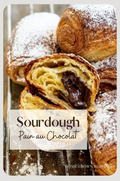 sourdough pain au chocolat with powdered sugar on top and chocolate in the middle