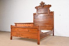 an antique wooden bed frame and foot board