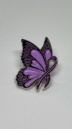 The Fibromyalgia Awareness pin is a powerful symbol of support for those who suffer from this chronic condition. This pin features a butterfly and purple ribbon, the official colour of fibromyalgia awareness. It has a butterfly clasp at the back to hold in place. to show solidarity and raise awareness about this debilitating condition. The pin is designed to inspire conversations about fibromyalgia and its impact on people's lives. It serves as a reminder that millions of individuals struggle with the physical and emotional challenges of fibromyalgia, often going undiagnosed or misunderstood. Wearing this pin can also help those living with fibromyalgia feel less isolated and more connected to a larger community of individuals who share similar experiences. By promoting awareness and under Purple Ribbon Tattoos, Special Tattoos, Ribbon Tattoos, Medical Bracelet, Hope Symbol, Chronic Condition, Purple Ribbon, Cover Up Tattoos, Mom Tattoos