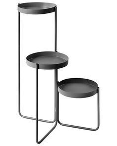 two black trays sitting on top of each other next to each other with metal legs