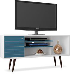 an entertainment center with a flat screen tv on it's sideboard and shelves