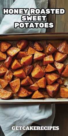 baked sweet potatoes in a baking dish with text overlay that reads honey roasted sweet potatoes