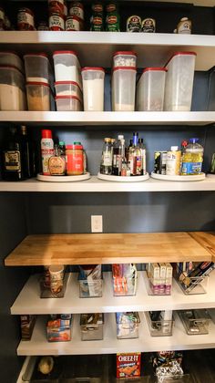 the shelves are full of food and containers