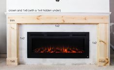 a fireplace with measurements for the size and width in front of it, along with an electric fire place