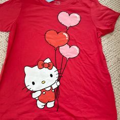 Hello Kitty Nwt Short Sleeve Shirt Size Large. The Color Is A Mix Of Red And Pink. This Short Sleeve Shirt Is So Cute!!! Thanks For Looking. Ships From Atlanta Smoke And Pet Free Home Hello Kitty Red Cartoon Print Top For Spring, Fun Hello Kitty Short Sleeve Tops, Playful Hello Kitty Short Sleeve Tops, Fun Hello Kitty Print Tops, Red Cartoon Print T-shirt For Spring, Cute Red Crew Neck Top, Cute Red Cotton Top, Cute Red Fitted T-shirt, Cute Fitted Red T-shirt