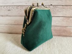 a green purse sitting on top of a table