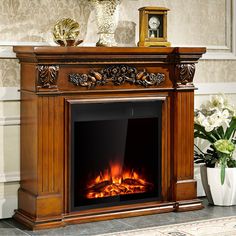 a fireplace with an ornate mantel and fire in it