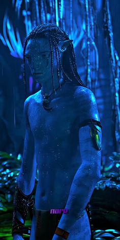 a man with dreadlocks standing in the water