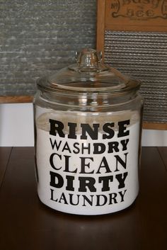 a glass jar that has the words rinse washdry clean dirty laundry on it