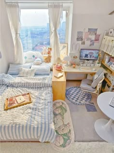 a bedroom with a bed, desk and chair next to a window overlooking the city