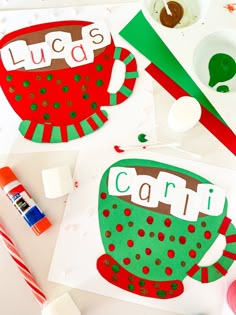 paper cutouts with the words lucas and cari on them next to candy canes