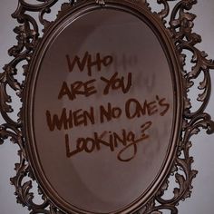 a mirror with writing on it that says who are you when no one's looking?