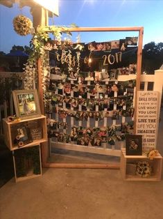 a display with pictures and flowers on it