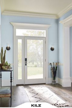 a room with blue walls and white trim