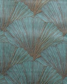 a close up view of a blue and brown wallpaper with fan shaped designs on it