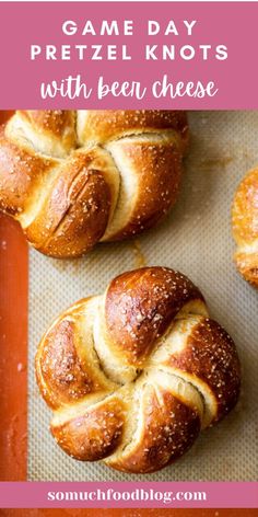 two hot cross buns on a baking sheet with the title game day pretzel knots with been cheese