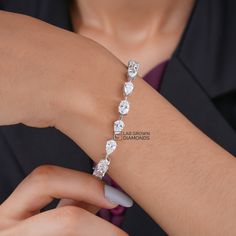 Oval and Pear Shape Tennis Bracelet, Mixed Shaped Fancy Cut Diamond Bracelet in 14K White Gold, Vintage Lab Grown Diamond Chain Bracelet  *Stone: Lab Grown Diamond *Metal:  14k Solid Gold *Net Gold - 11.33 *       No. Of Diamond - 16 *        Bracelet Length - 6.5 Inches *Carat - 10.952 *Diamond color: White *      Silver weight: 11.33           *      Diamond Weight: 10.95         *Handmade item Metal Finishing Available: 14k Solid Yellow Gold, 14k Sold Rose Gold and 14K Solid White Gold    *Gi Luxury Multi-stone Diamond Bracelet For Anniversary, Luxury Diamond Cut Bangle For Anniversary, Luxury White Gold Oval Diamond Bracelet, White Gold Pear-shaped Cubic Zirconia Bracelets, Silver Pear-shaped Anniversary Bracelets, Silver Pear-shaped Bracelets For Anniversary, Pear-shaped Silver Bracelet For Anniversary, Fine Jewelry Pear-shaped Cubic Zirconia Bracelet, Pear-shaped Cubic Zirconia Bracelet