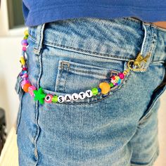 Rainbow Beaded Personalized Belt Chain Add a splash of color and personality to any outfit with our Rainbow Beaded Belt Chain! Featuring a delightful variety of cute and fun beads in every color of the rainbow, this belt chain is the perfect accessory for girls, teens, and tweens who love to express their unique style. ✨ Personalized Touch: Customize your belt chain with a name, saying, or any word that holds special meaning. Just let us know your desired text, and we'll create a one-of-a-kind p Jeans Chain Beads, Beaded Jeans, 80s Gift, Rainbow Belts, Jeans Chain, Pant Chains, Belt Chain, Y2k Jewelry