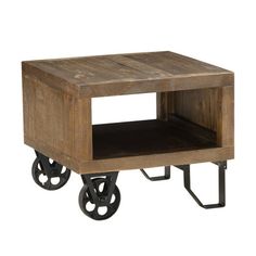 a small wooden table with wheels on it