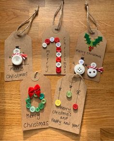 four christmas gift tags with buttons on them