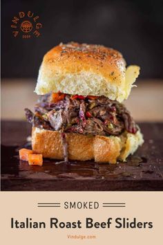 an italian roast beef slider is shown on a wooden cutting board with text overlay that reads smoked italian roast beef sliders