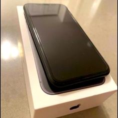 an iphone is sitting in a box on the table