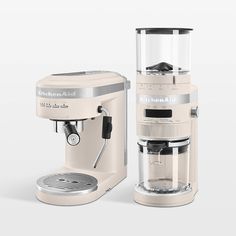 an image of a coffee maker and espresso machine set up on a white background