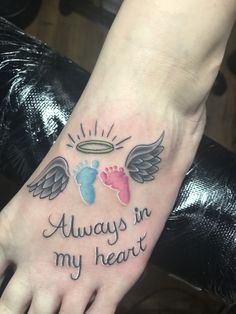 a person with a tattoo on their foot that says, always in my heart and an angel