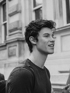 black and white photograph of a young man smiling