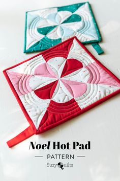 two quilted coasters with the words noel hot pad on them