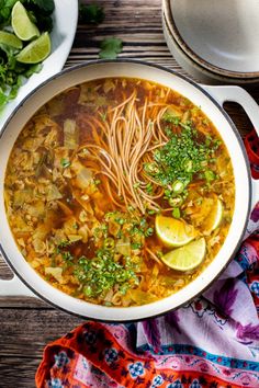 a bowl of soup with noodles and vegetables