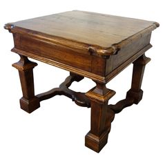 an old wooden table with two legs and a drawer on the top, sitting against a white background