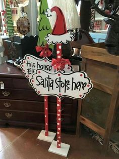 a sign that says this house is santa's stop here