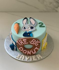 a blue cake with a bunny on it