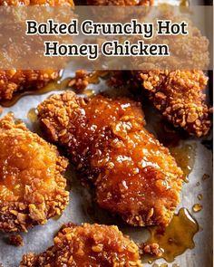 baked crunchy hot honey chicken on a baking sheet with the words, baked crunchy hot honey chicken