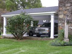 two cars are parked in the garage with their doors open and there is no one inside