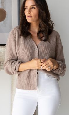 A timeless, versatile classic that layers beautifully with just about any outfit for an effortlessly chic look. Knit with supremely warm and lightweight cashmere, you won't want to leave home without it. V-neck cardigan with elegant ribbed knit. White pearlescent buttons. Hits at the hips. Wear open or buttoned up. FIT: Relaxed fit. Size down if you're between sizes. 100% LUXURY CASHMERE Silk Slip Skirt, Cashmere Winter Scarf, Silk Tee, Cashmere Pants, Cashmere Socks, Cashmere Beanie, Silk Pajama Set, Silk Slip Dress, Cashmere Turtleneck