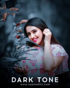 a woman is posing for a photo in front of some plants and flowers with the words dark tone on it