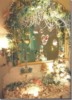 a bathroom decorated for christmas with ornaments and lights