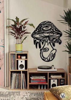 a record player sitting on top of a wooden shelf next to a potted plant