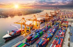 an aerial view of shipping containers at the port