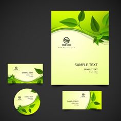 a set of business cards and envelopes with green leaves