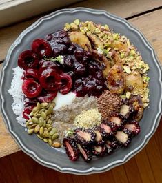 a plate filled with different types of food on top of a wooden table