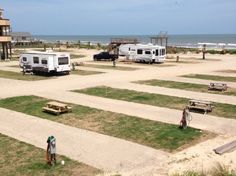 an rv park with several recreational vehicles parked on the beach