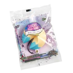 the lucky fortune toy is packaged in a plastic bag on a white background with stars