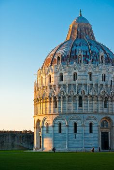 the dome of an old building is lit up