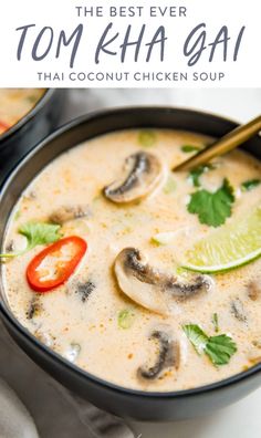 a bowl filled with soup and topped with sliced limes, cilantro, and mushrooms